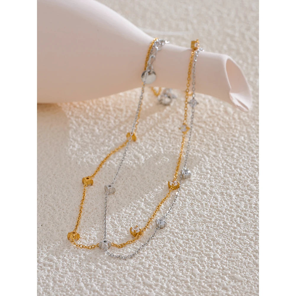 Cubic zirconia geometric necklace in gold-plated stainless steel with cubic zirconia.