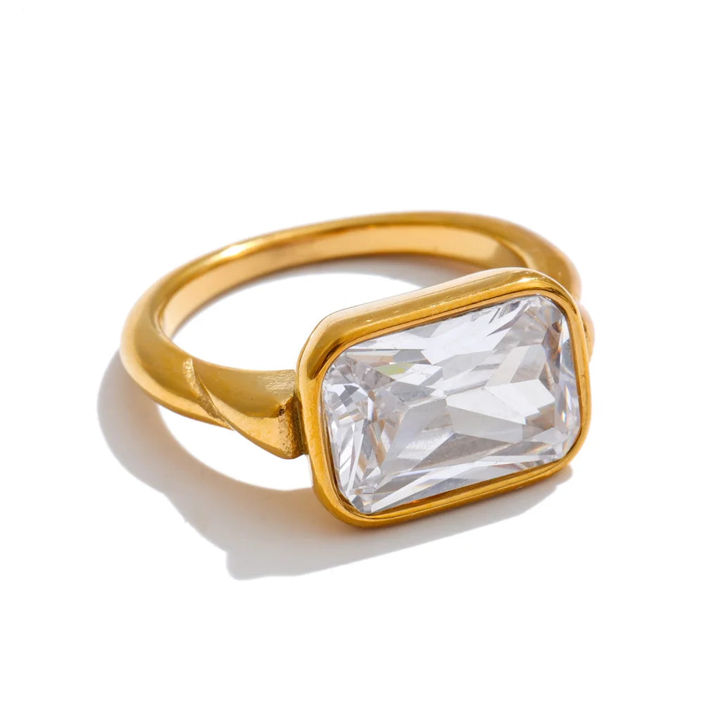Cubic zirconia geometric ring in 18K gold-plated stainless steel with cubic zirconia.