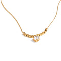 Cubic zirconia beaded geometric necklace in gold-plated stainless steel with cubic zirconia.