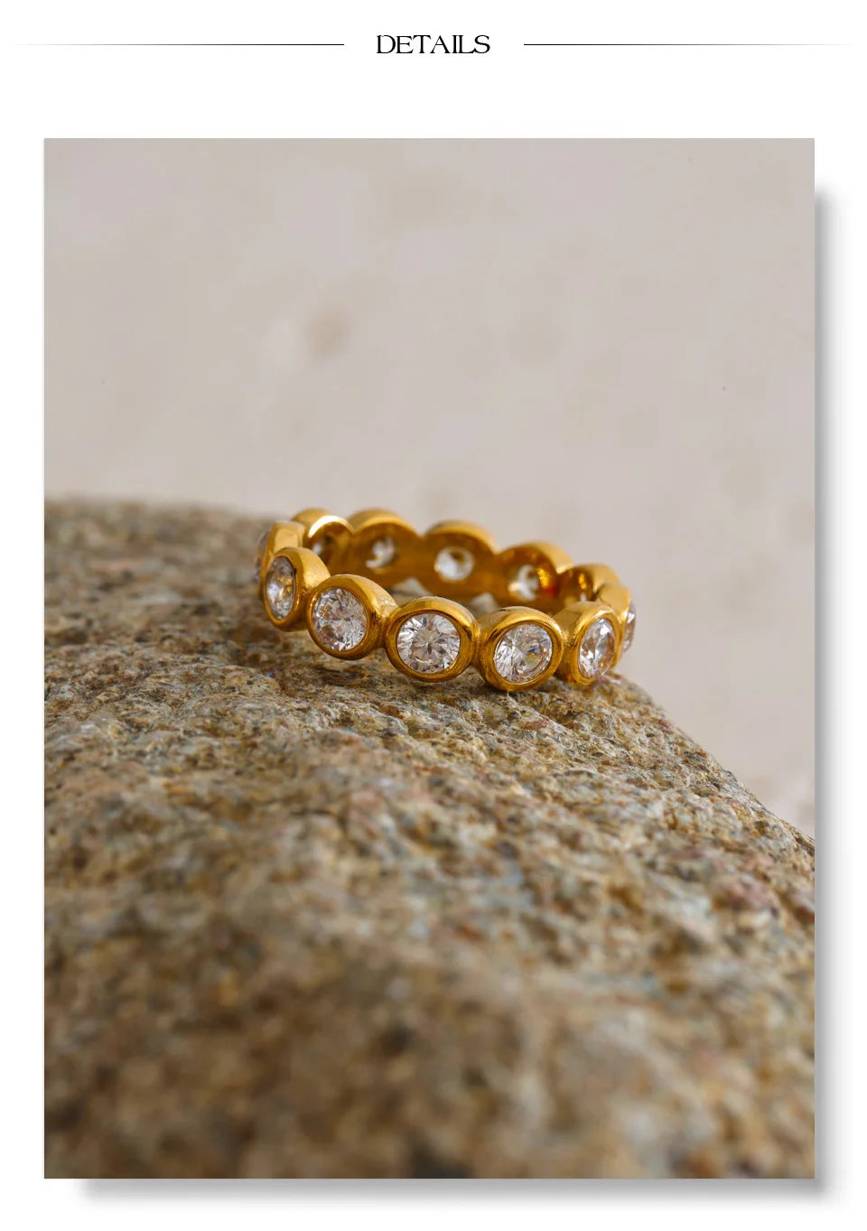 Cubic zirconia geometric ring in 18K gold-plated stainless steel with cubic zirconia.