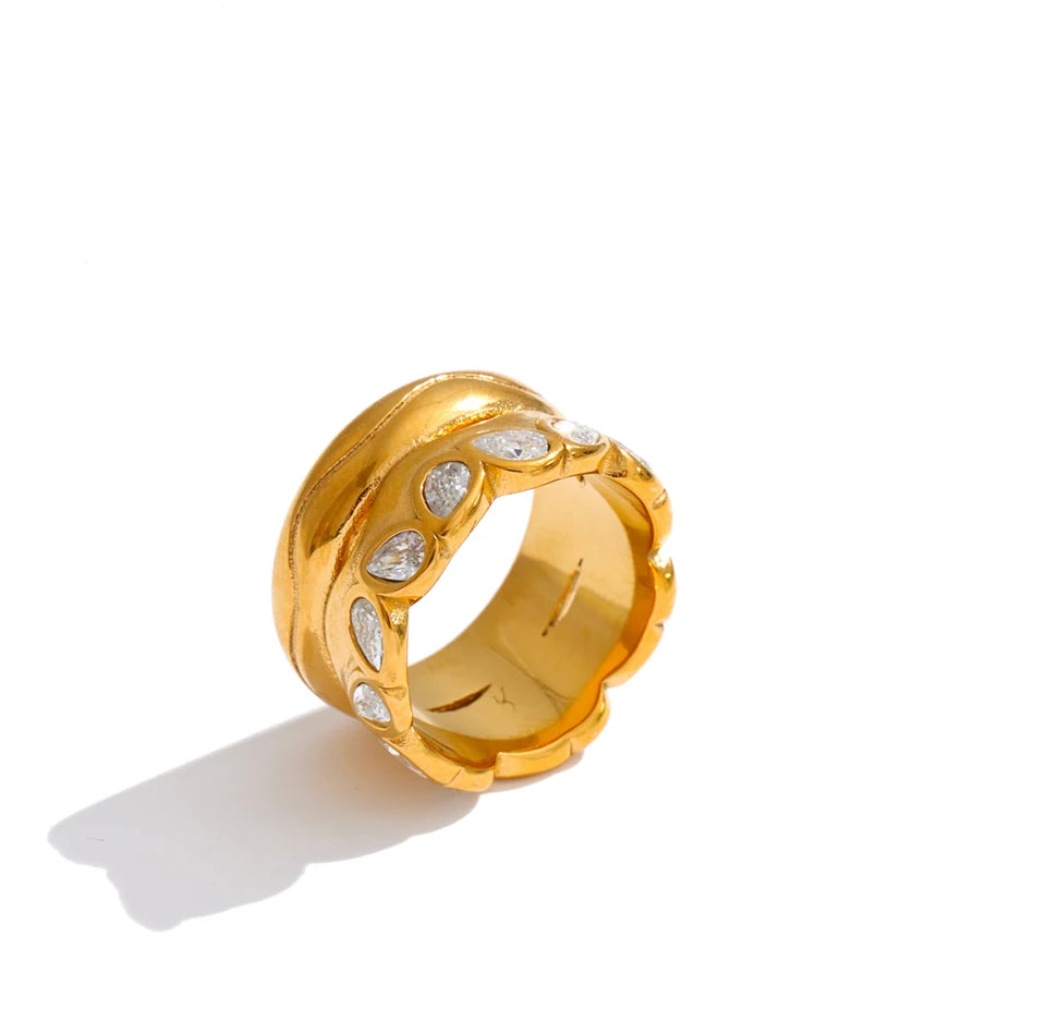 Cubic zirconia geometric ring in 18K gold-plated stainless steel with cubic zirconia.