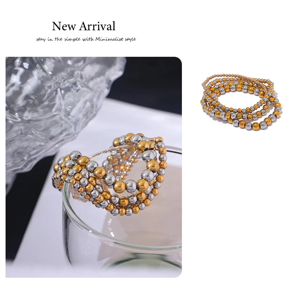 Beaded geometric bracelet in gold-plated stainless steel.