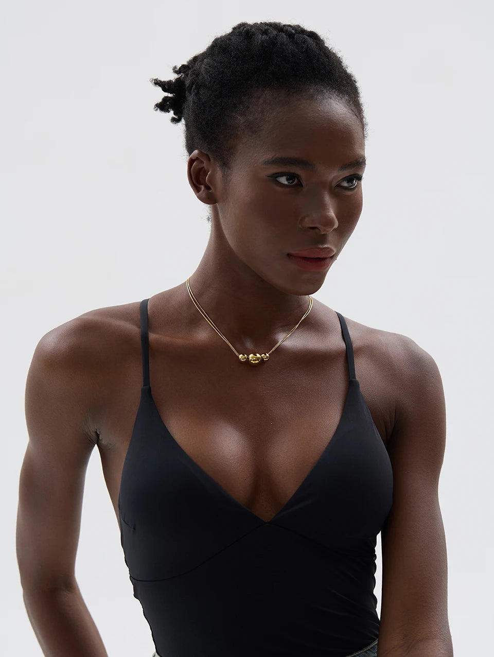 Beaded geometric chain necklace in gold-plated 316L stainless steel.