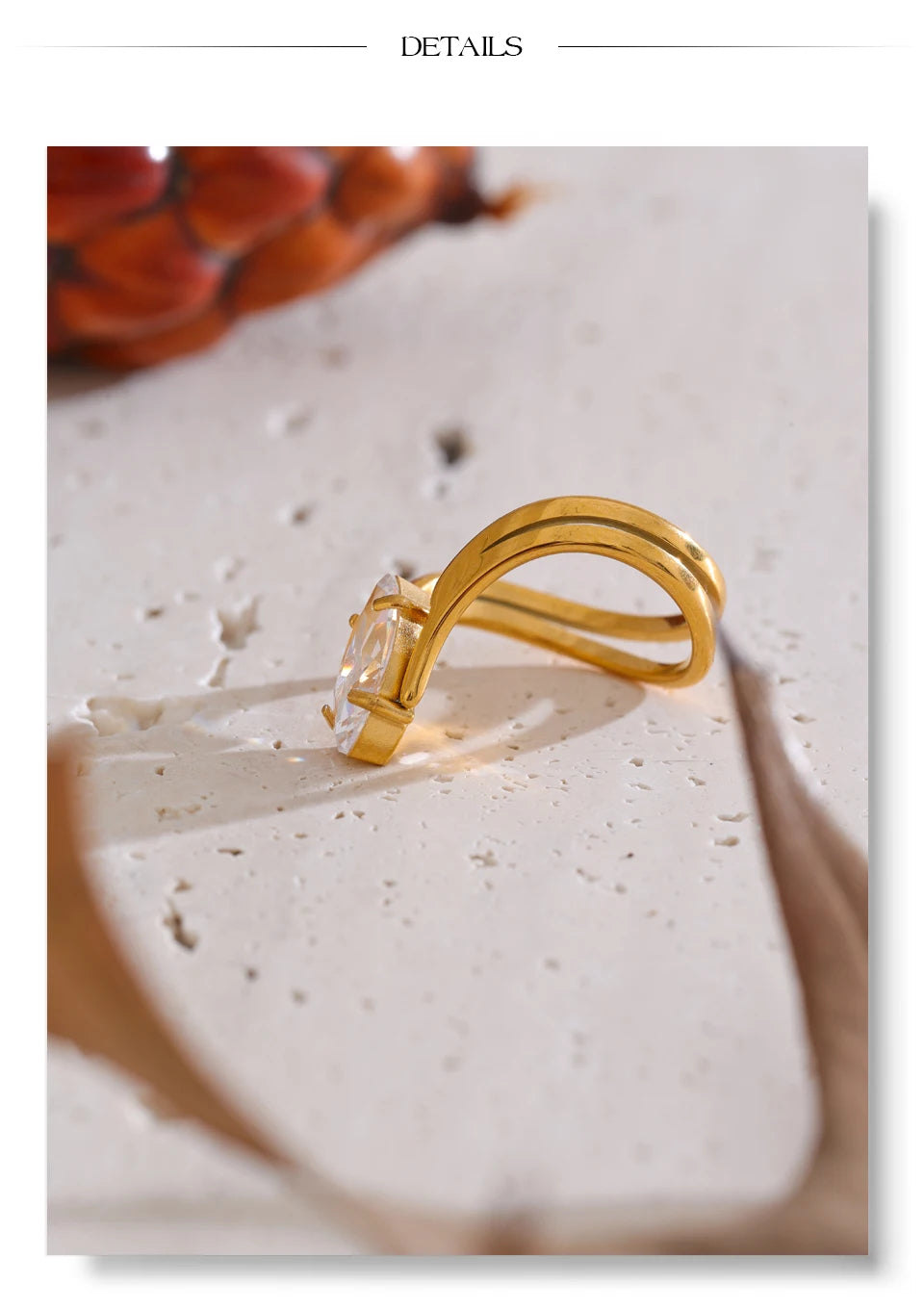 Cubic zirconia geometric ring in 18K gold-plated stainless steel with cubic zirconia.