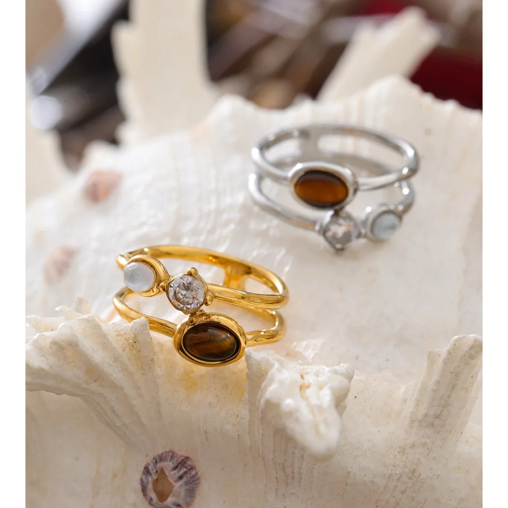 Cubic zirconia natural stone geometric ring in 18K gold-plated stainless steel with cubic zirconia and natural stone.