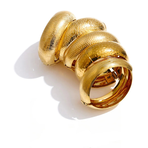 Gold-plated stainless steel bracelet with multiple rings.