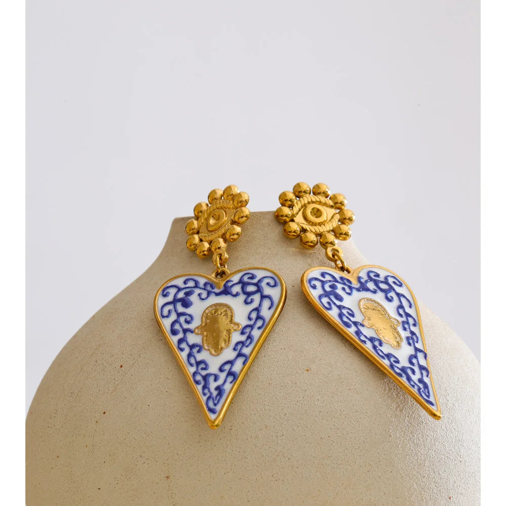Blue enamel heart earrings in gold-plated stainless steel with enamel.