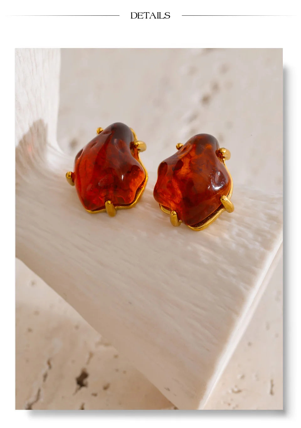 Black resin acrylic earrings in gold-plated stainless steel with resin and acrylic.