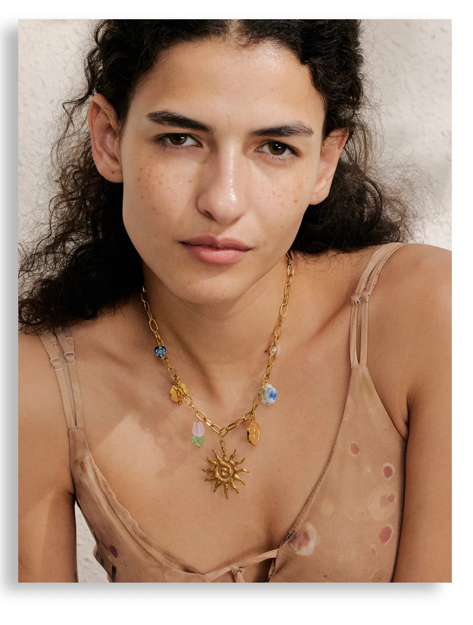 Sun geometric necklace in gold-plated stainless steel.