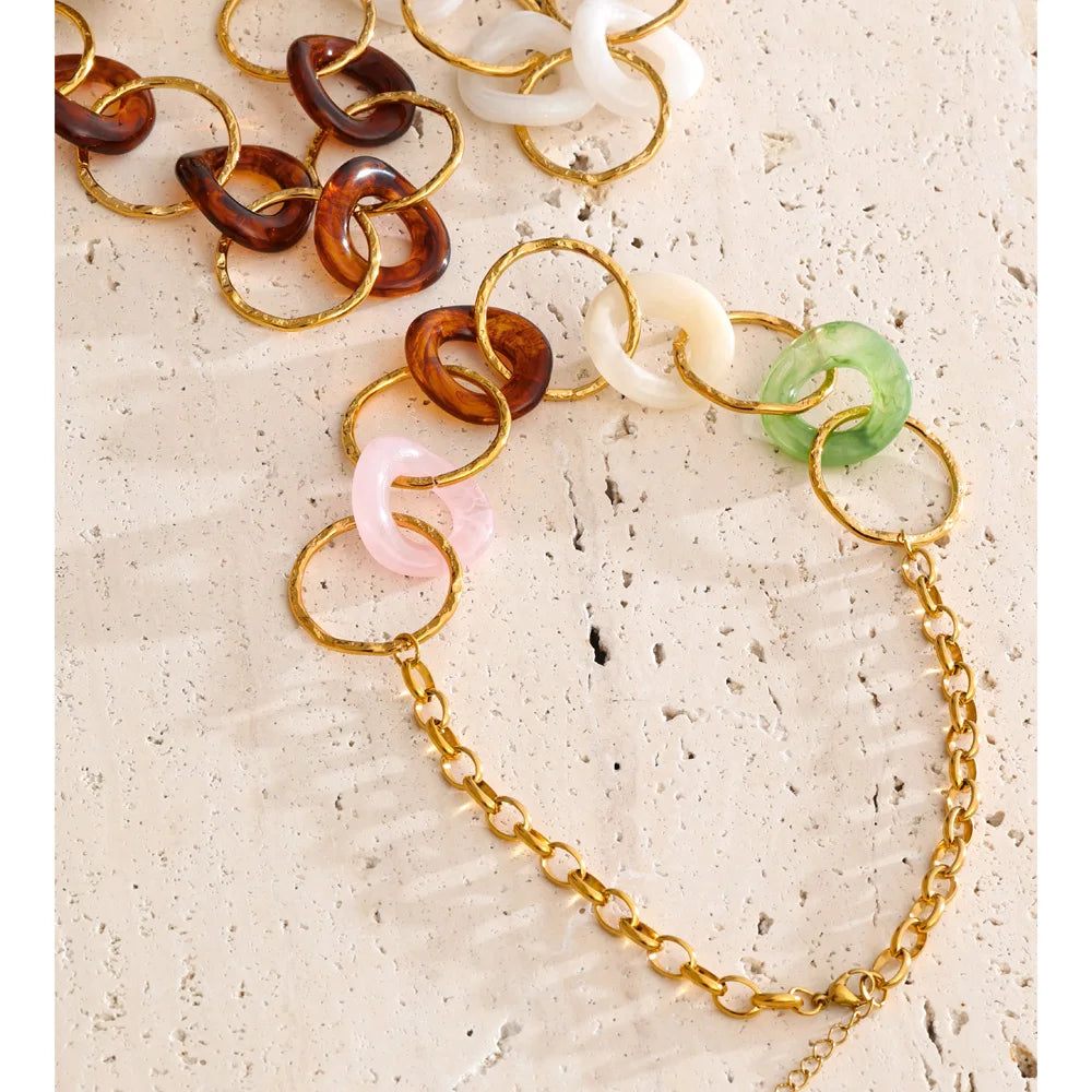 Resin acrylic geometric necklace in gold-plated stainless steel with resin and acrylic.