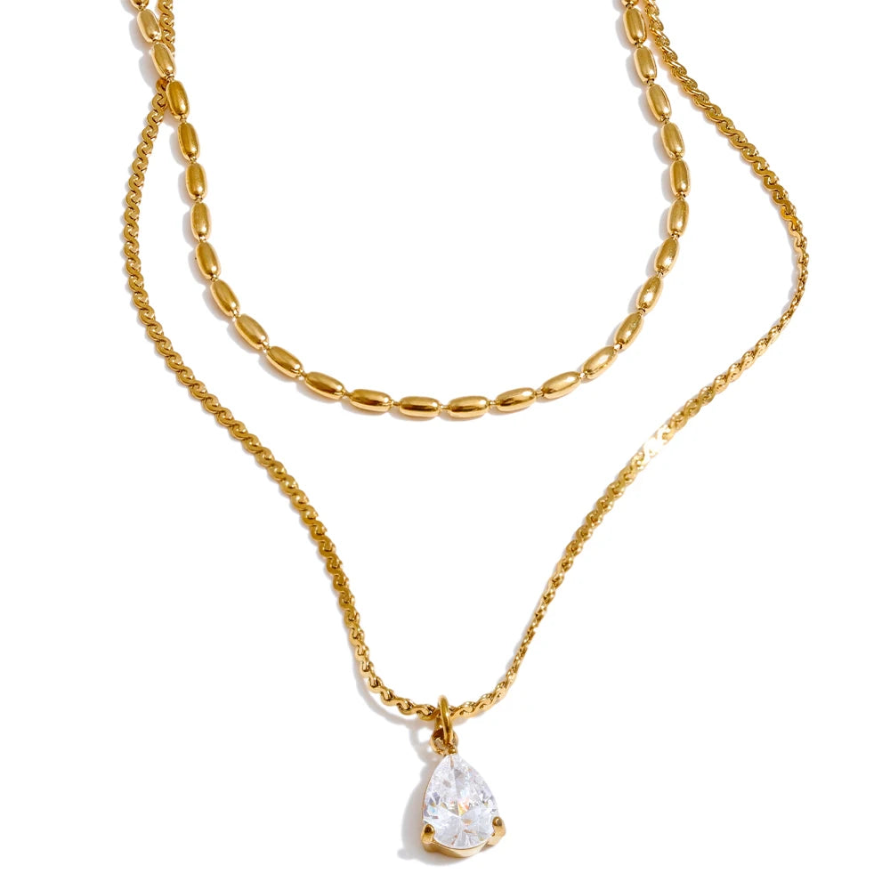 Cubic zirconia geometric layered necklace in gold-plated stainless steel with cubic zirconia.