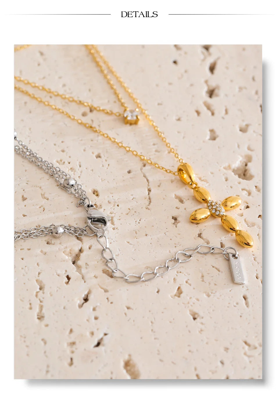 Cubic zirconia cross chain necklace in gold-plated stainless steel with cubic zirconia.