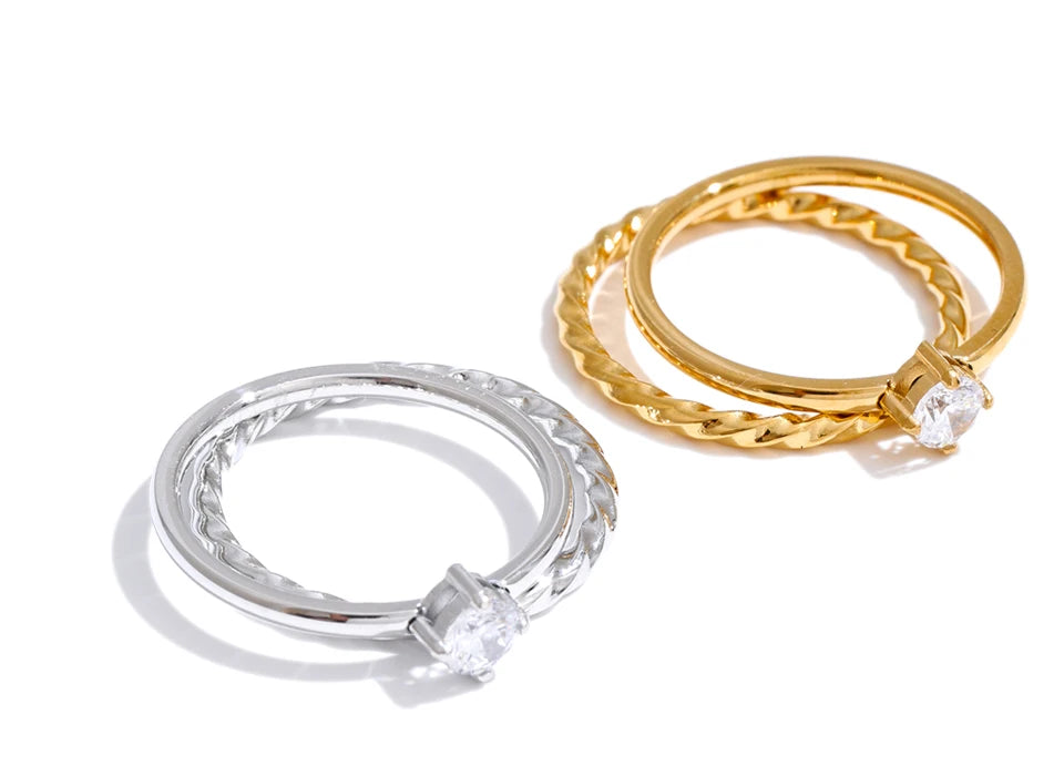 Cubic zirconia geometric ring in gold-plated stainless steel with cubic zirconia.