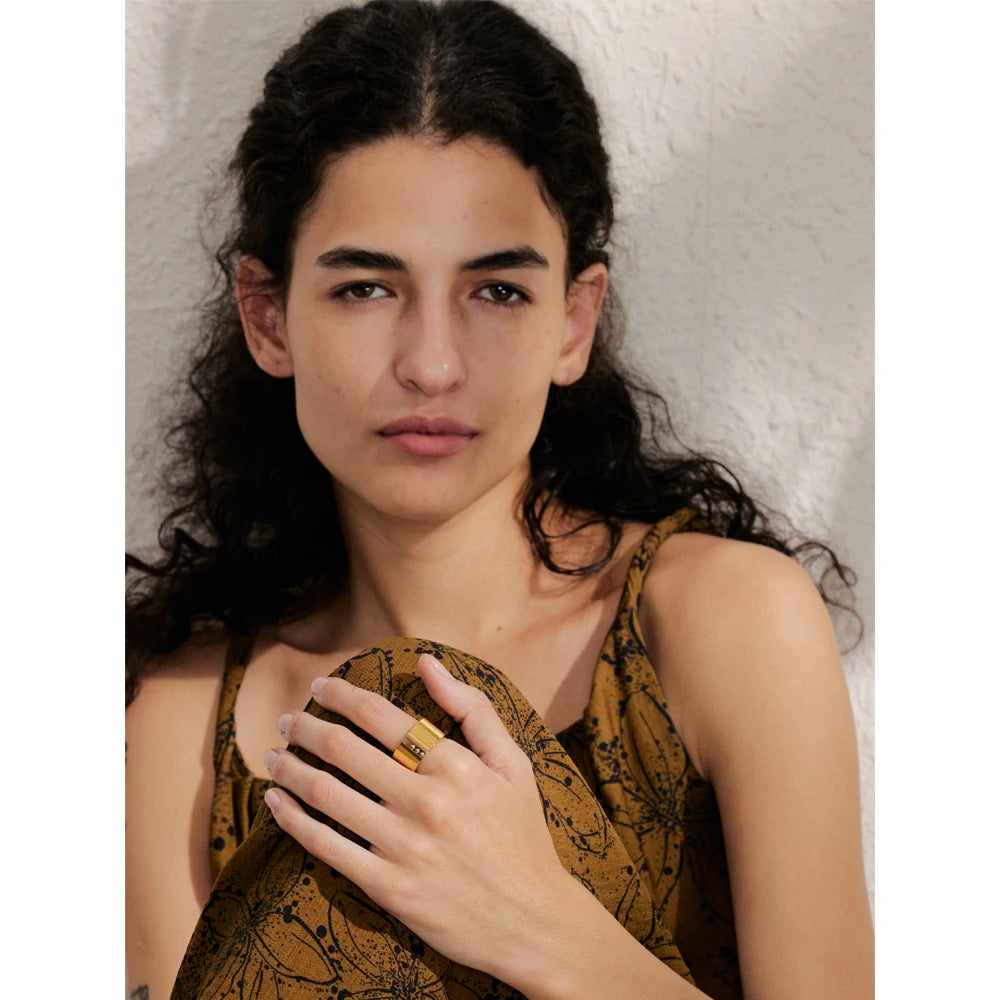 Geometric ring in gold-plated stainless steel.