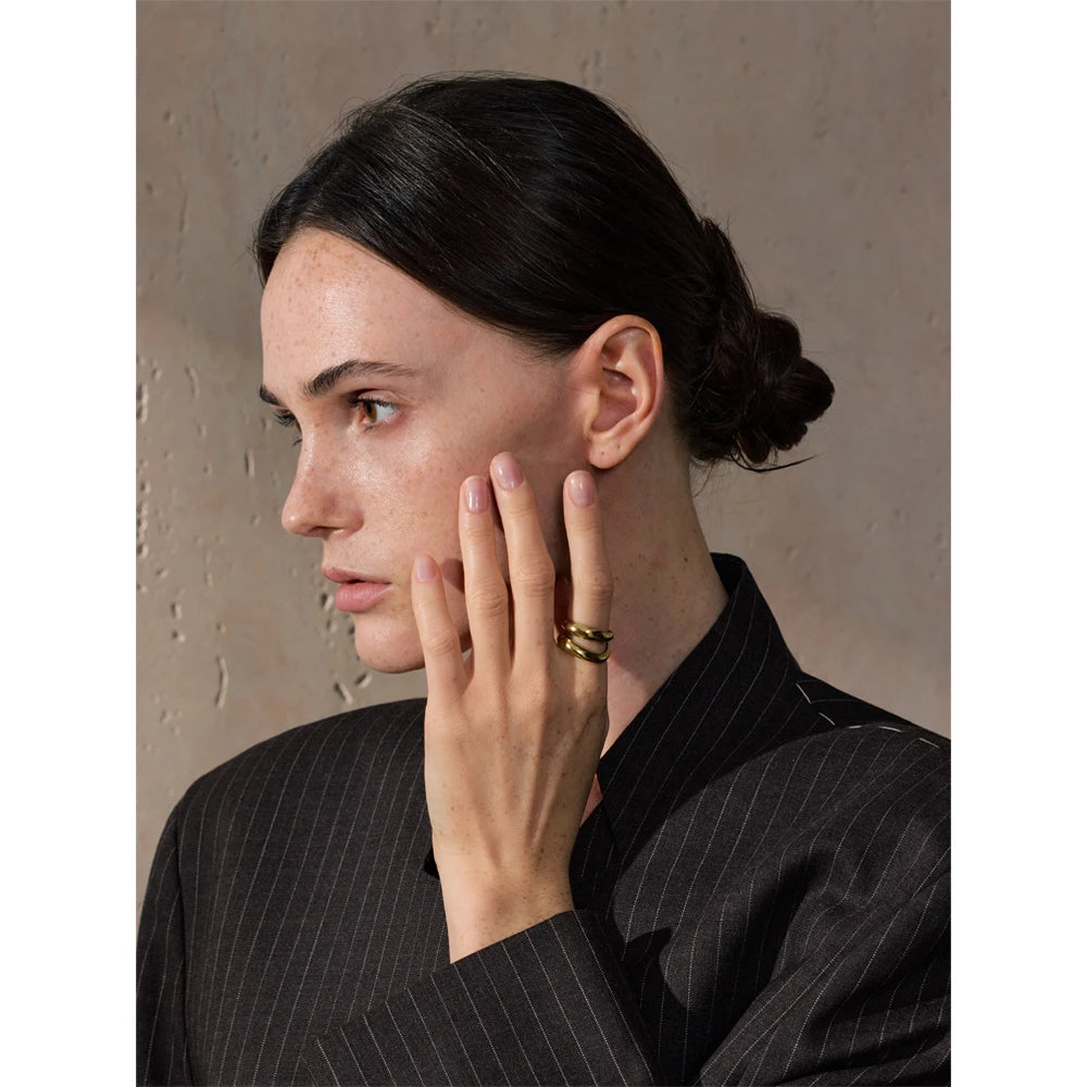 Geometric layered ring in gold-plated stainless steel.