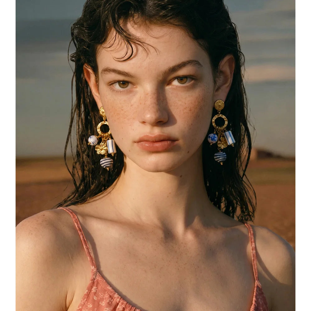 Blue heart flower earrings in gold-plated stainless steel.