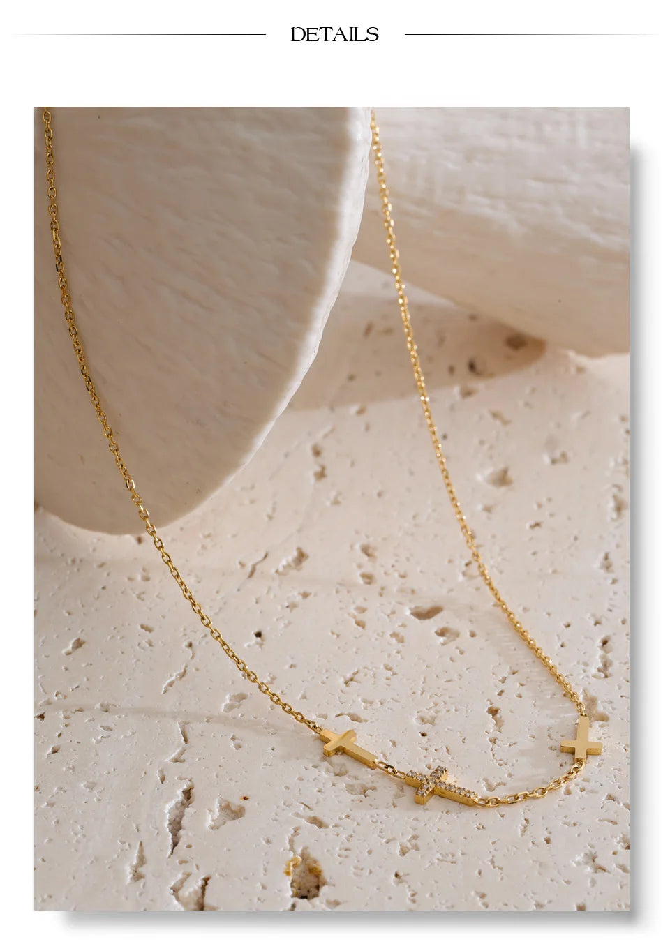 Cubic zirconia cross geometric necklace in gold-plated stainless steel with cubic zirconia.