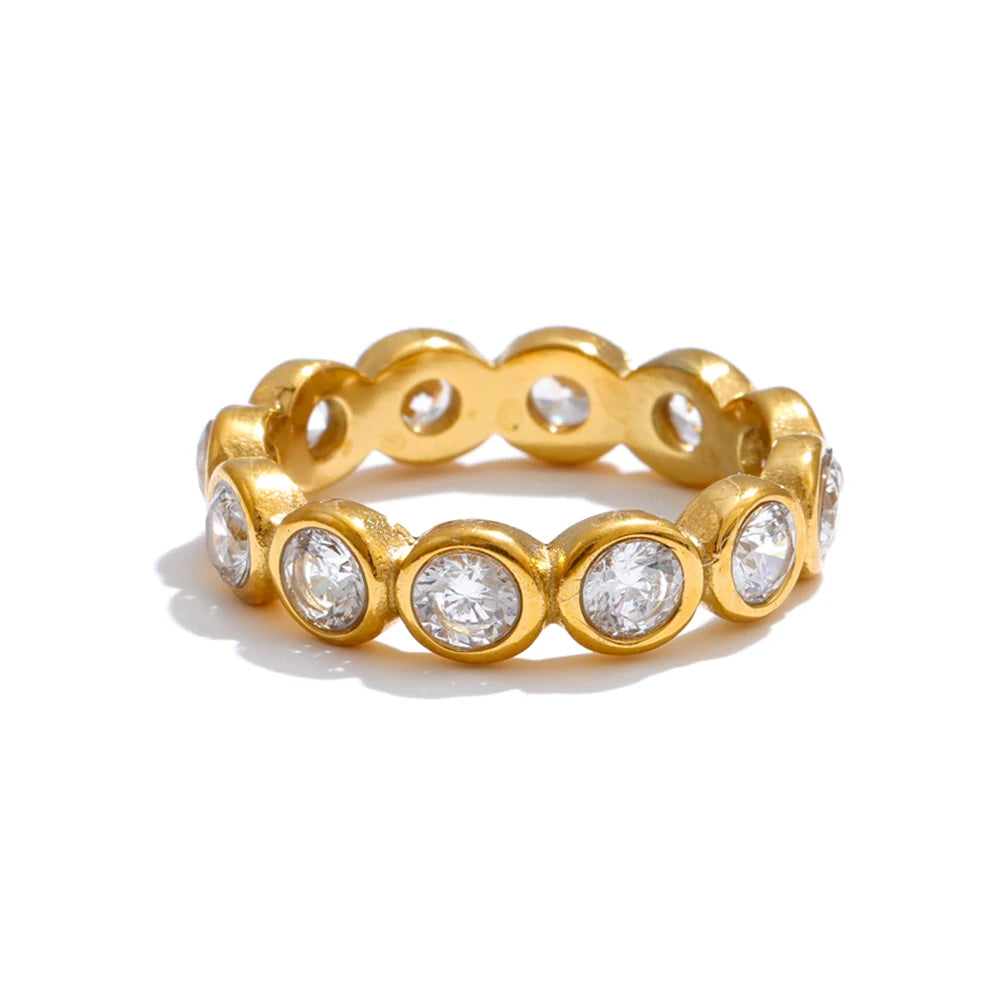 Cubic zirconia geometric ring in 18K gold-plated stainless steel with cubic zirconia.