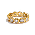 Cubic zirconia geometric ring in 18K gold-plated stainless steel with cubic zirconia.
