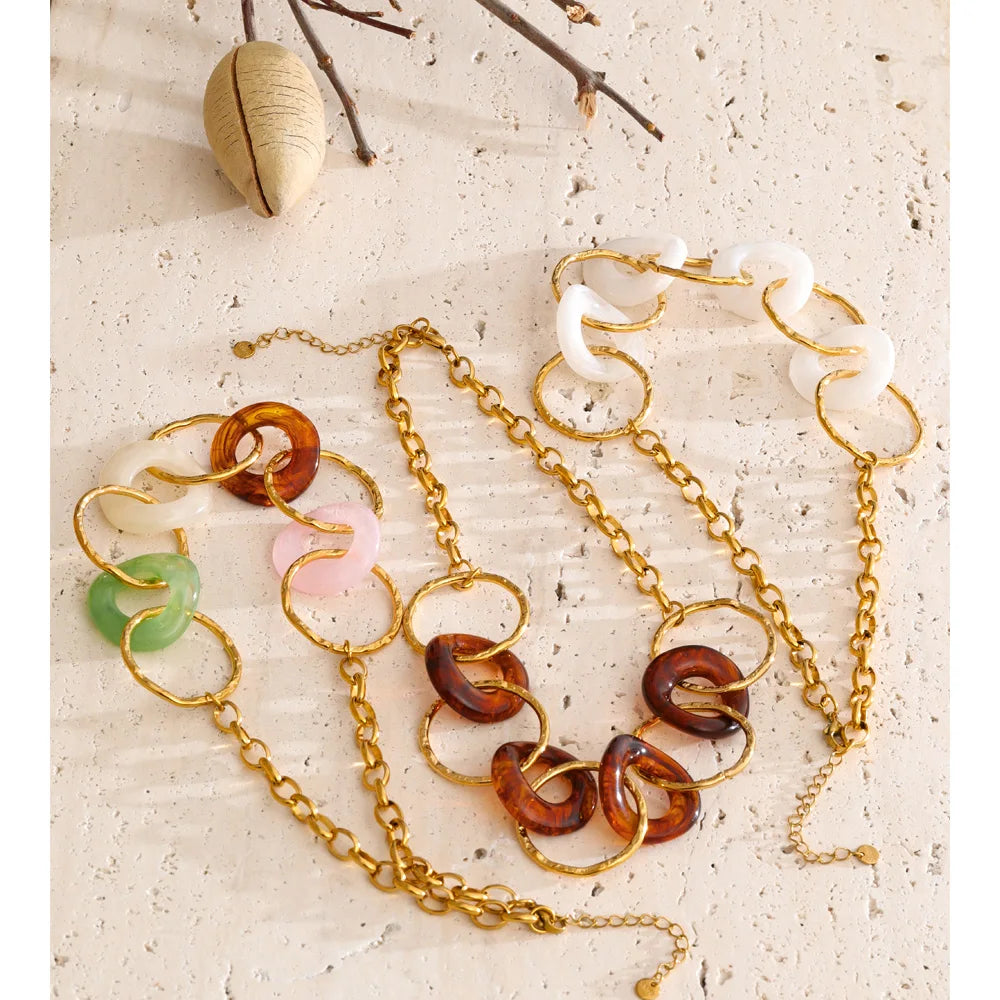 Resin acrylic geometric necklace in gold-plated stainless steel with resin and acrylic.