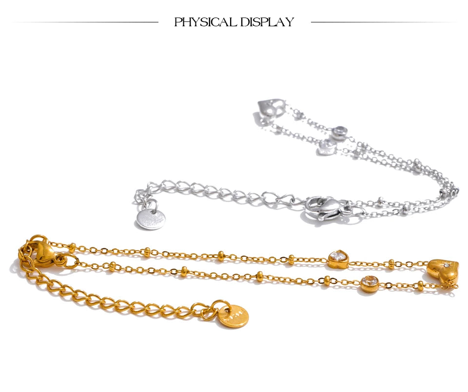 Cubic zirconia heart chain necklace in gold-plated stainless steel with cubic zirconia.