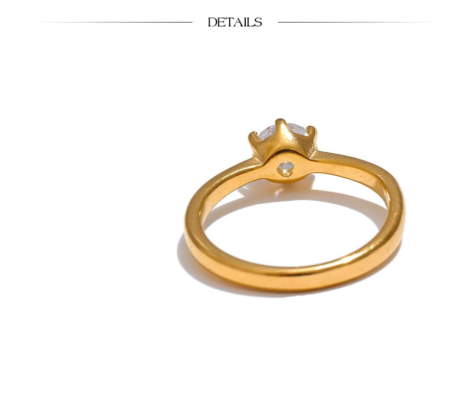 Cubic zirconia geometric ring in 18K gold-plated stainless steel with cubic zirconia.