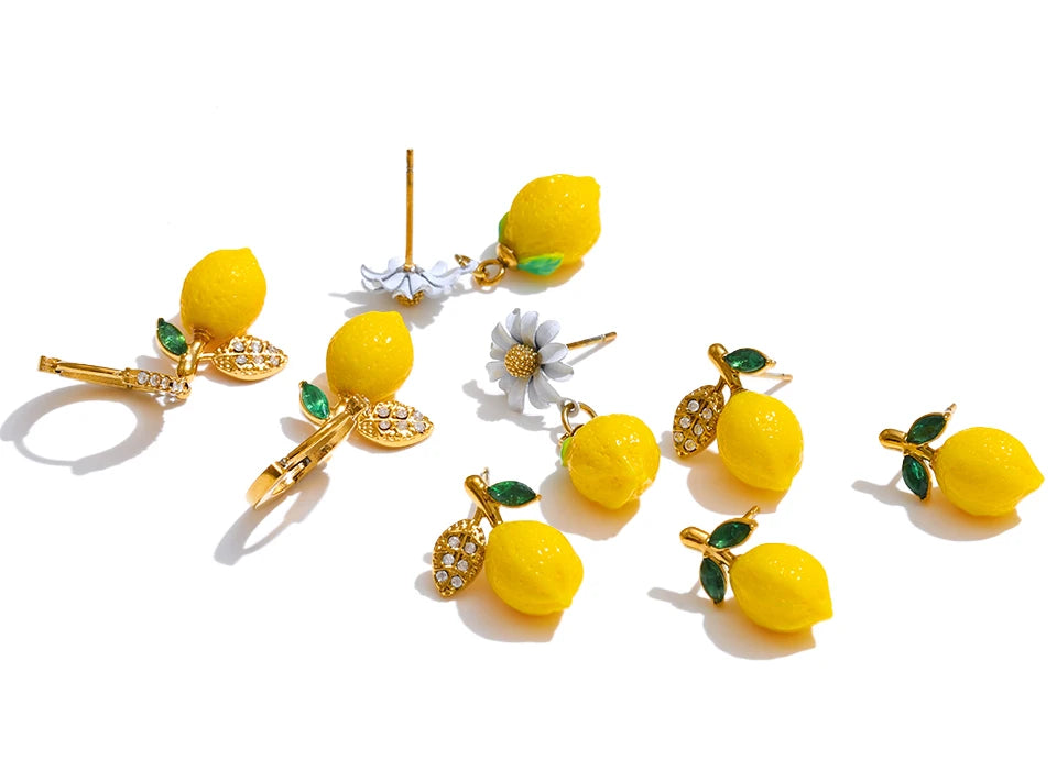Cubic zirconia resin geometric earrings in gold-plated stainless steel with cubic zirconia and resin.