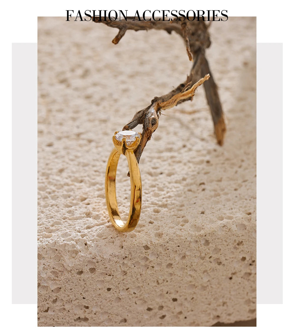 Cubic zirconia geometric ring in 18K gold-plated stainless steel with cubic zirconia.