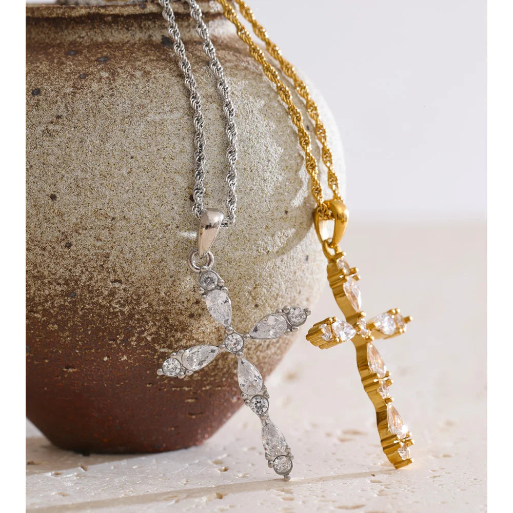 Cubic zirconia cross necklace in gold-plated stainless steel with cubic zirconia.