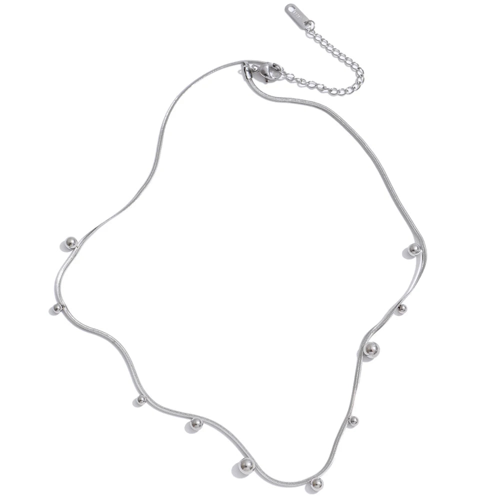 Beaded geometric chain necklace in gold-plated stainless steel.