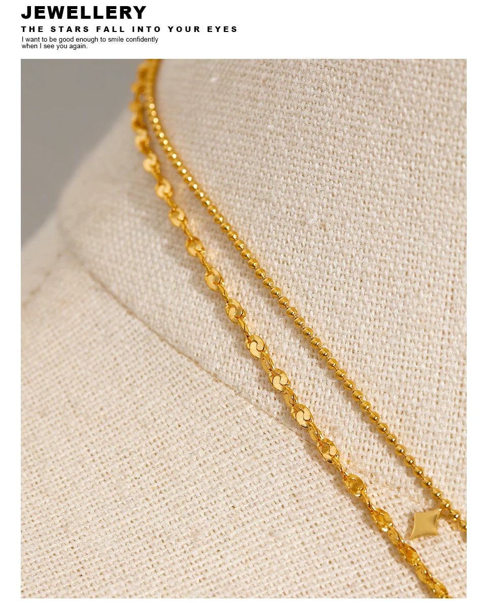 Geometric chain layered necklace in gold-plated stainless steel.
