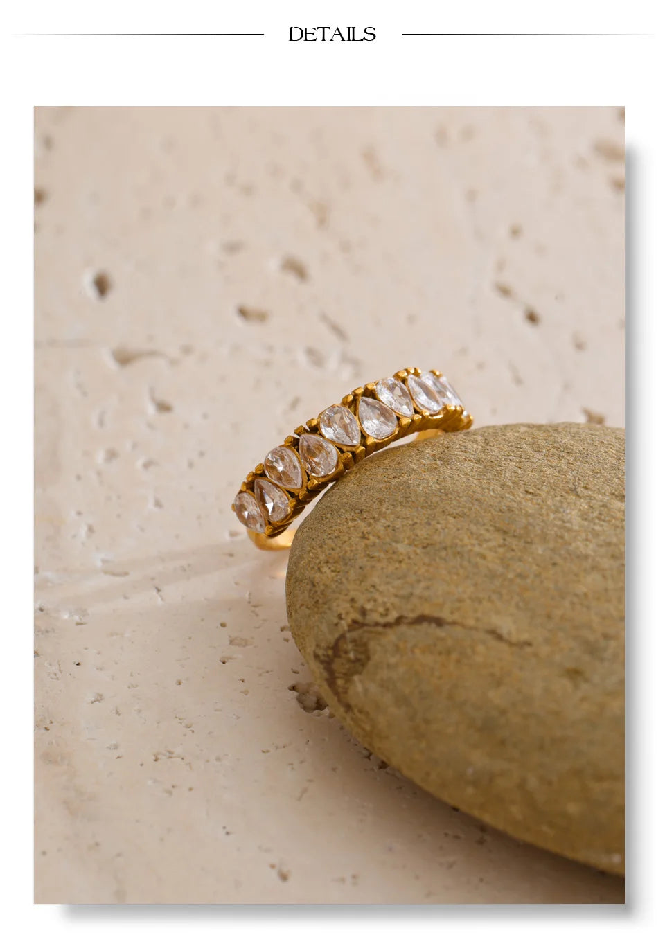 Cubic zirconia geometric ring in 18K gold-plated stainless steel with cubic zirconia.