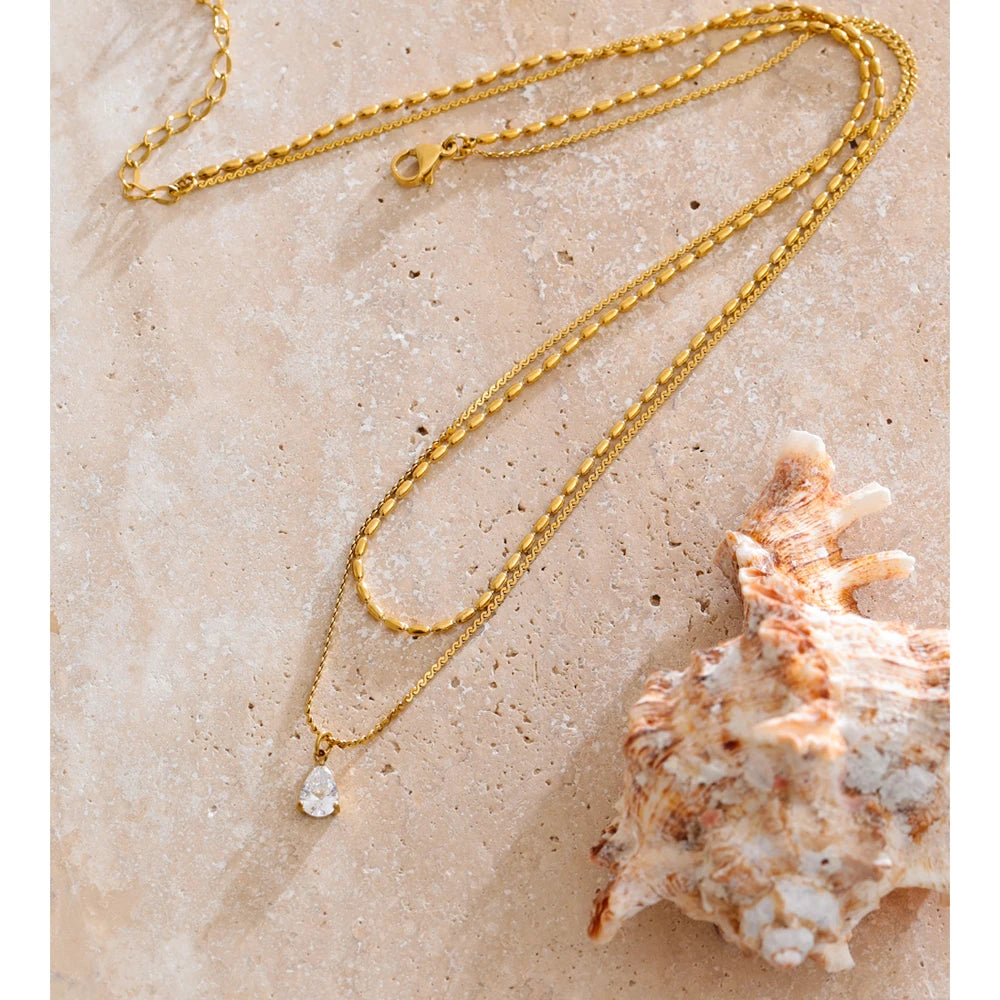 Cubic zirconia geometric layered necklace in gold-plated stainless steel with cubic zirconia.