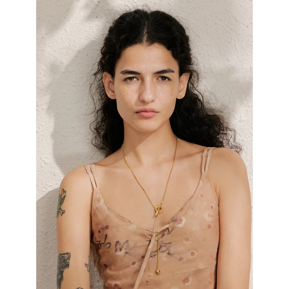 Geometric chain necklace in gold-plated stainless steel.