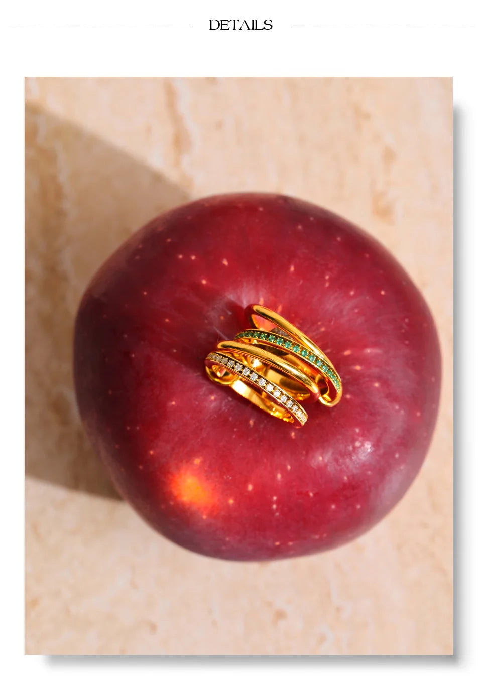 White cubic zirconia geometric ring in 18K gold-plated stainless steel with cubic zirconia.