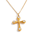 Cubic zirconia cross necklace in gold-plated stainless steel with cubic zirconia.