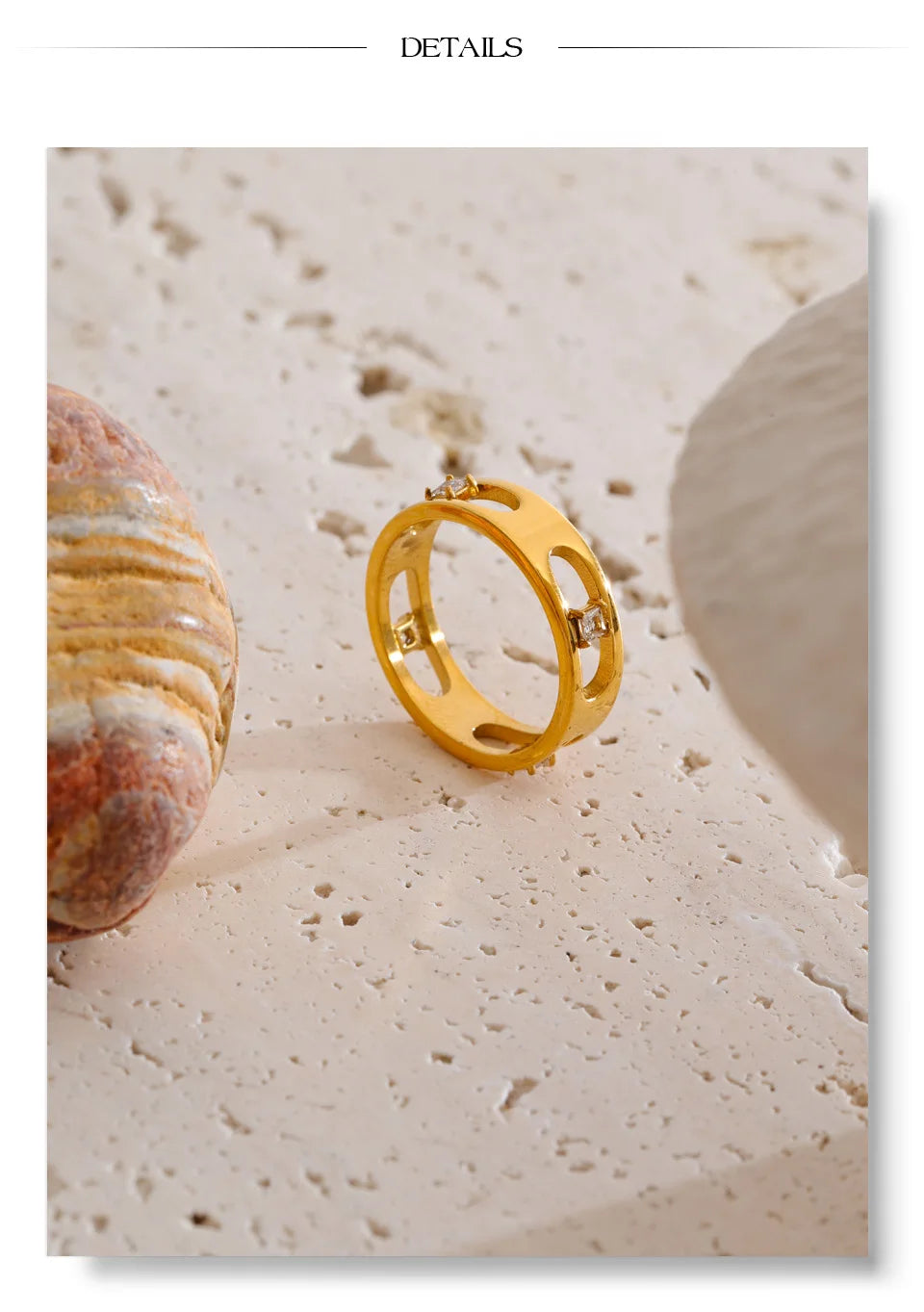 Cubic zirconia geometric ring in 18K gold-plated stainless steel with cubic zirconia.