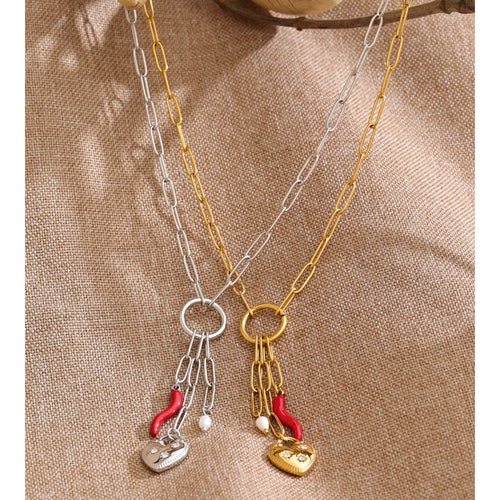 Cubic zirconia freshwater pearl heart necklace in gold-plated stainless steel with freshwater pearl and cubic zirconia.
