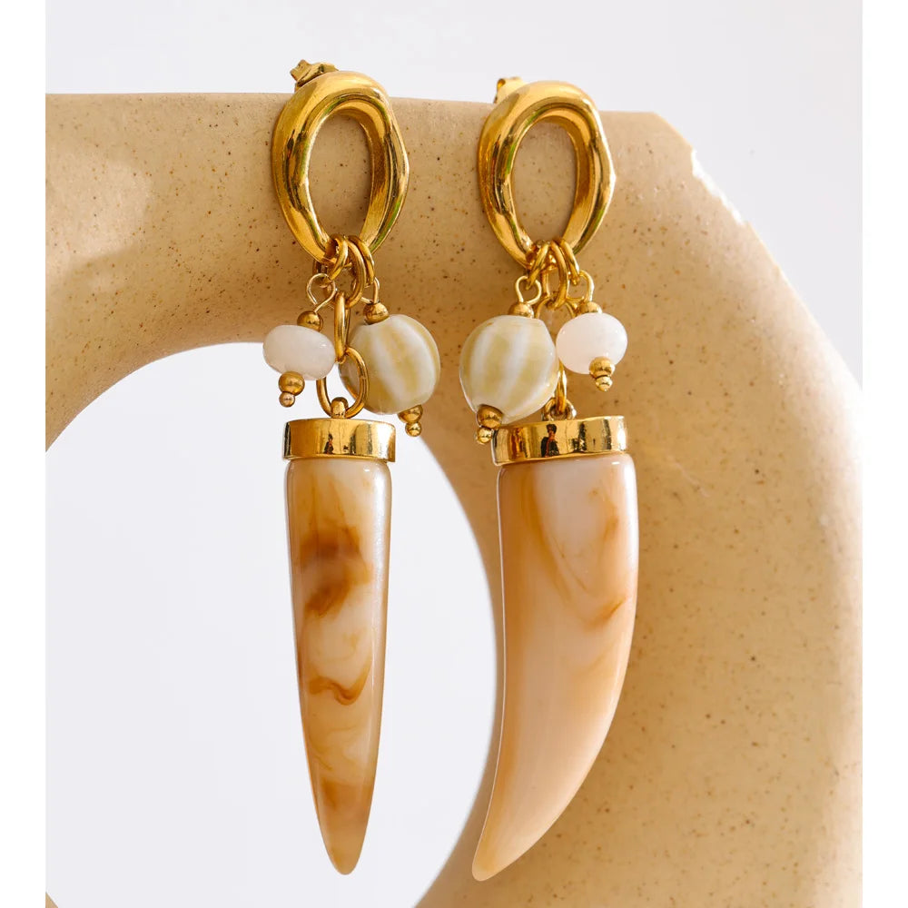Resin acrylic geometric earrings in gold-plated stainless steel with resin and acrylic.