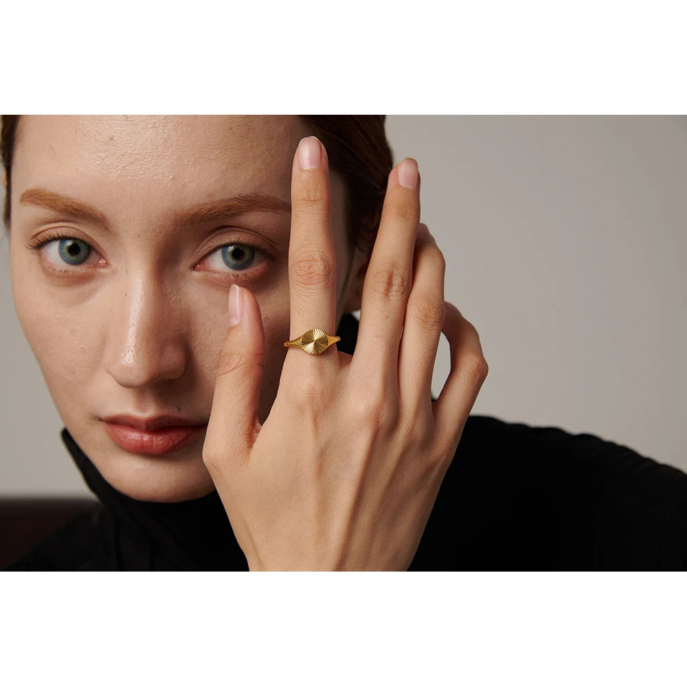 Geometric ring in gold-plated stainless steel.