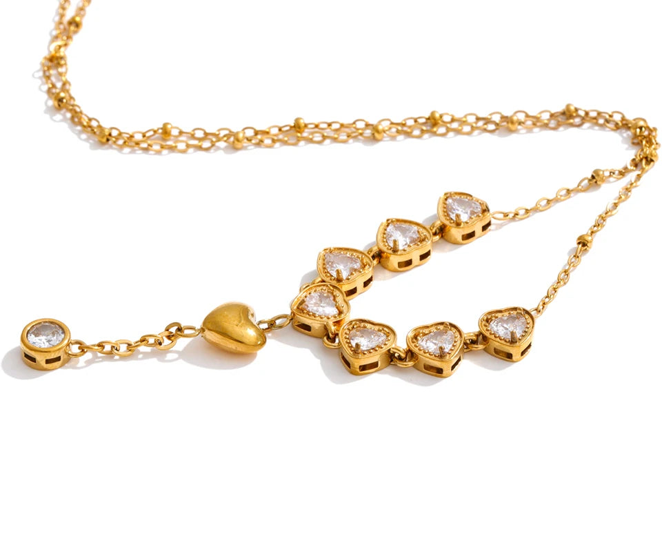 Cubic zirconia heart necklace in gold-plated stainless steel with cubic zirconia.