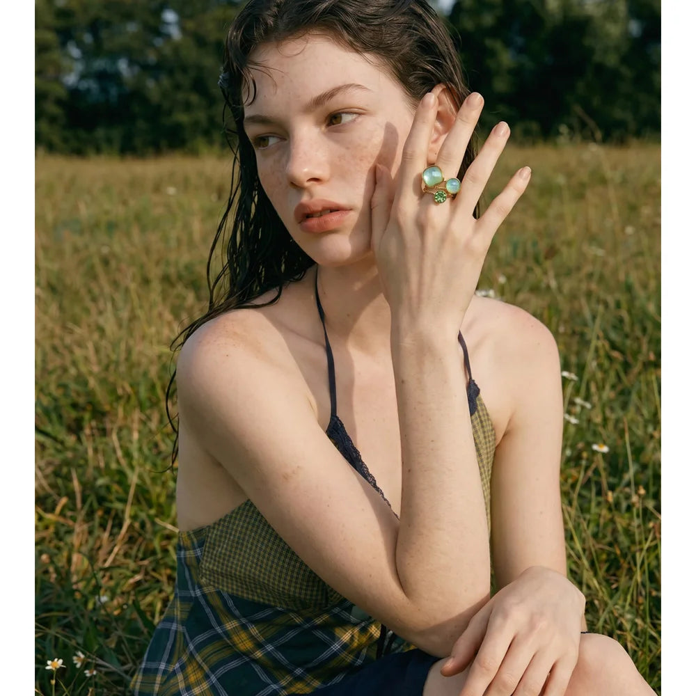 Crystal multi-color geometric ring in 18K gold-plated stainless steel with crystal.