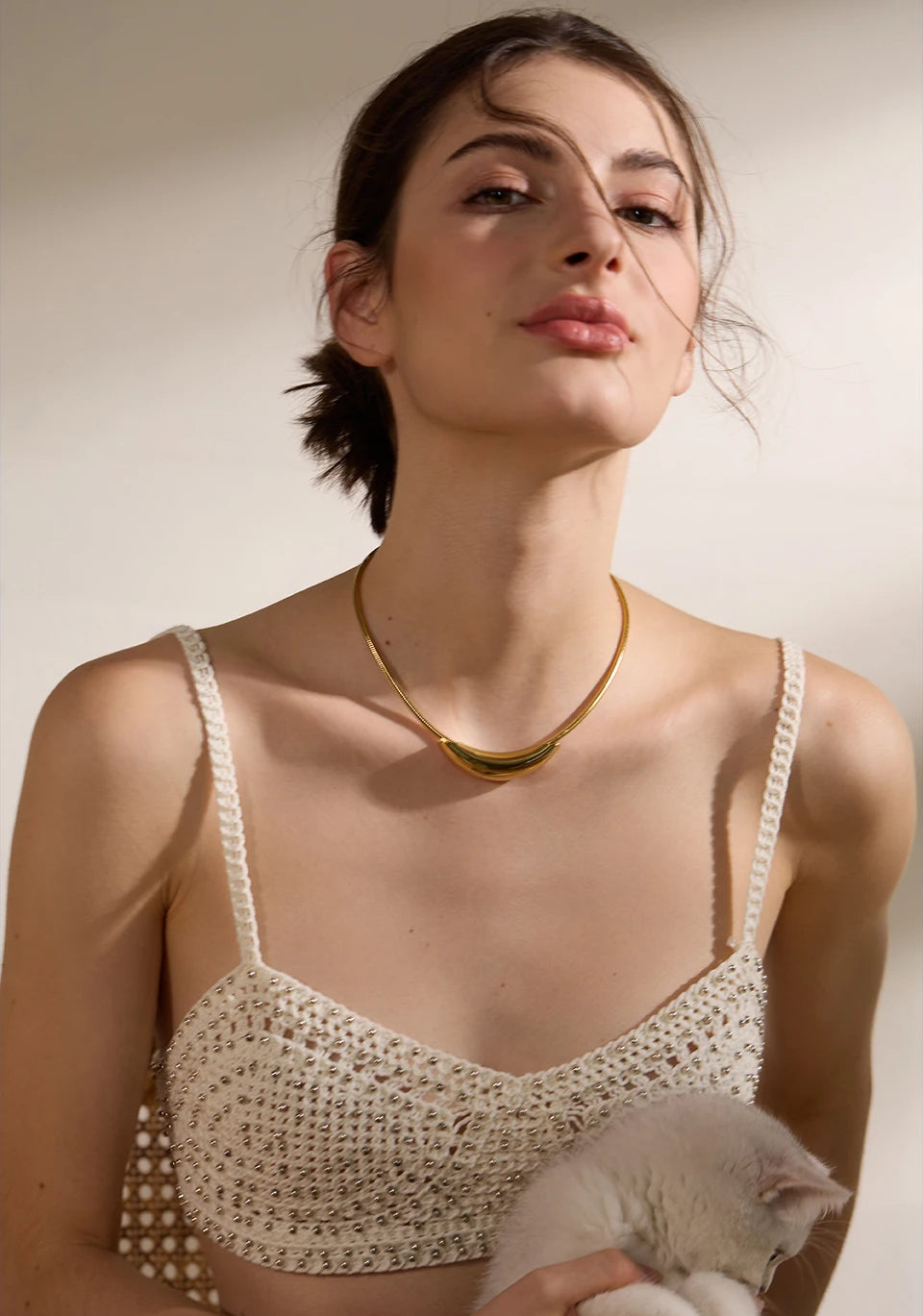 Geometric chain necklace in gold-plated stainless steel.