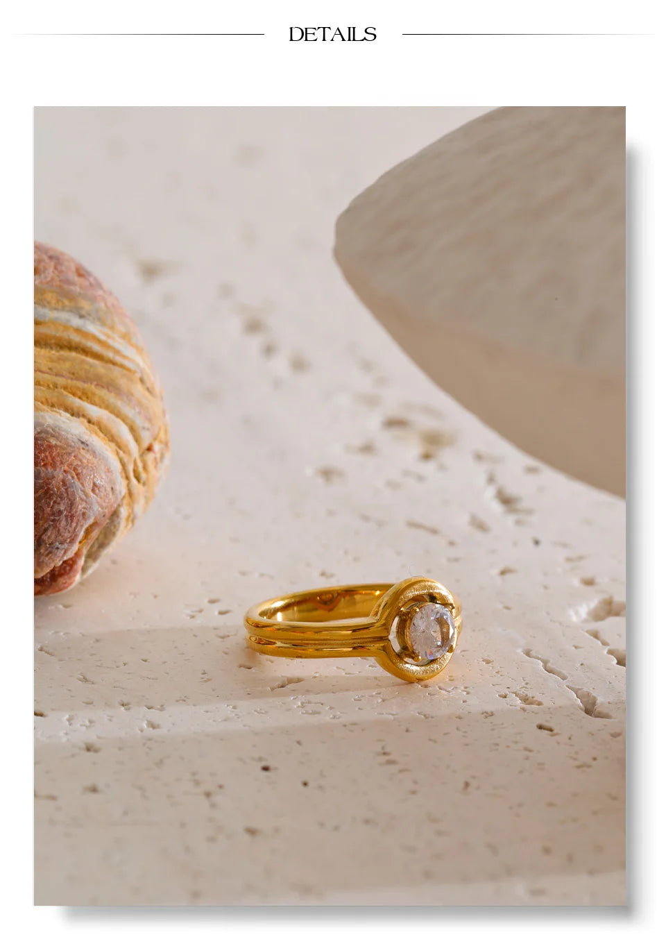 Cubic zirconia geometric ring in 18K gold-plated stainless steel with cubic zirconia.