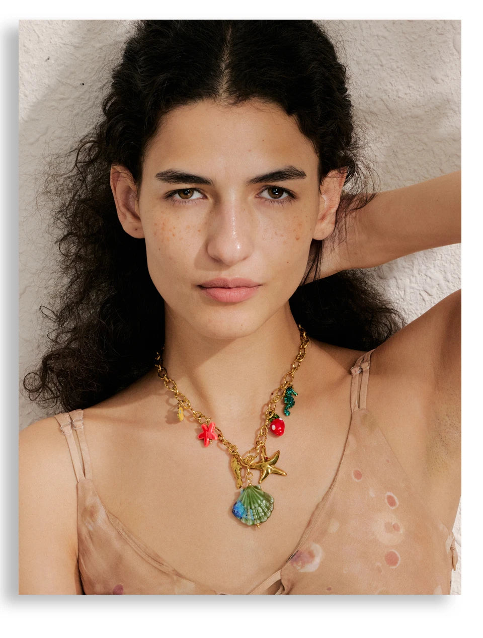 Shell enamel star necklace in gold-plated stainless steel with shell and enamel.