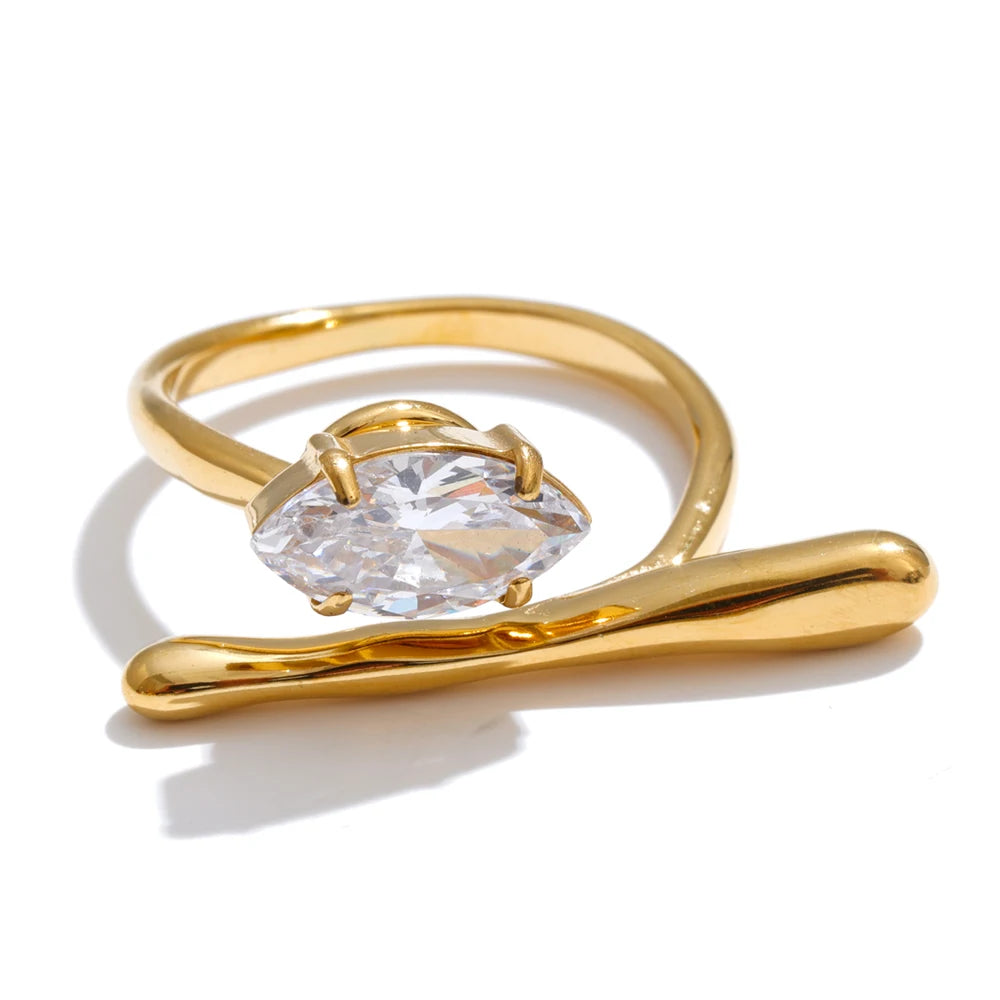 Cubic zirconia geometric ring in 18K gold-plated stainless steel with cubic zirconia.