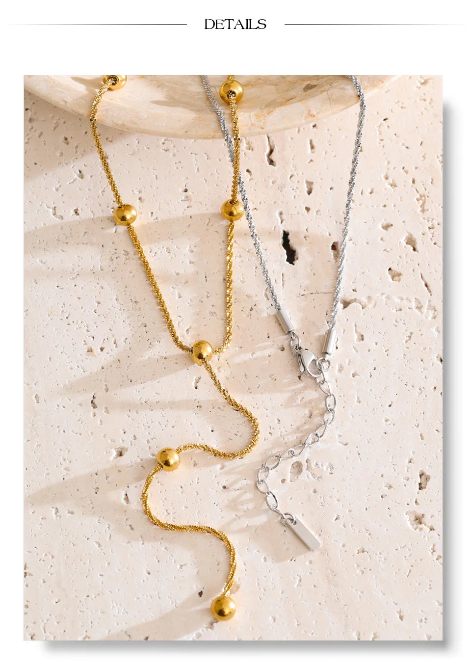 Beaded geometric chain necklace in gold-plated stainless steel.