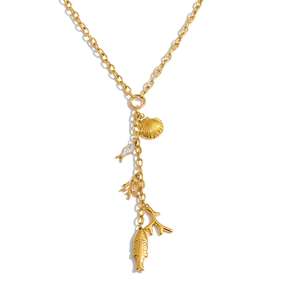 Cubic zirconia shell geometric necklace in gold-plated stainless steel with cubic zirconia and shell.