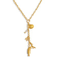Cubic zirconia shell geometric necklace in gold-plated stainless steel with cubic zirconia and shell.