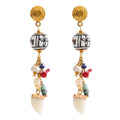 Resin natural stone geometric earrings in gold-plated stainless steel with natural stone and resin.